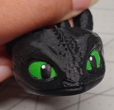Toothless flexi head in black with hand painted eyes.