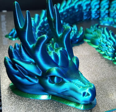 Asian dragon in dual green and blue silk